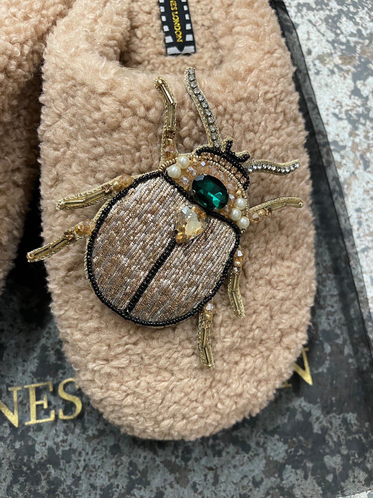 Beige closed toe beetle slippers