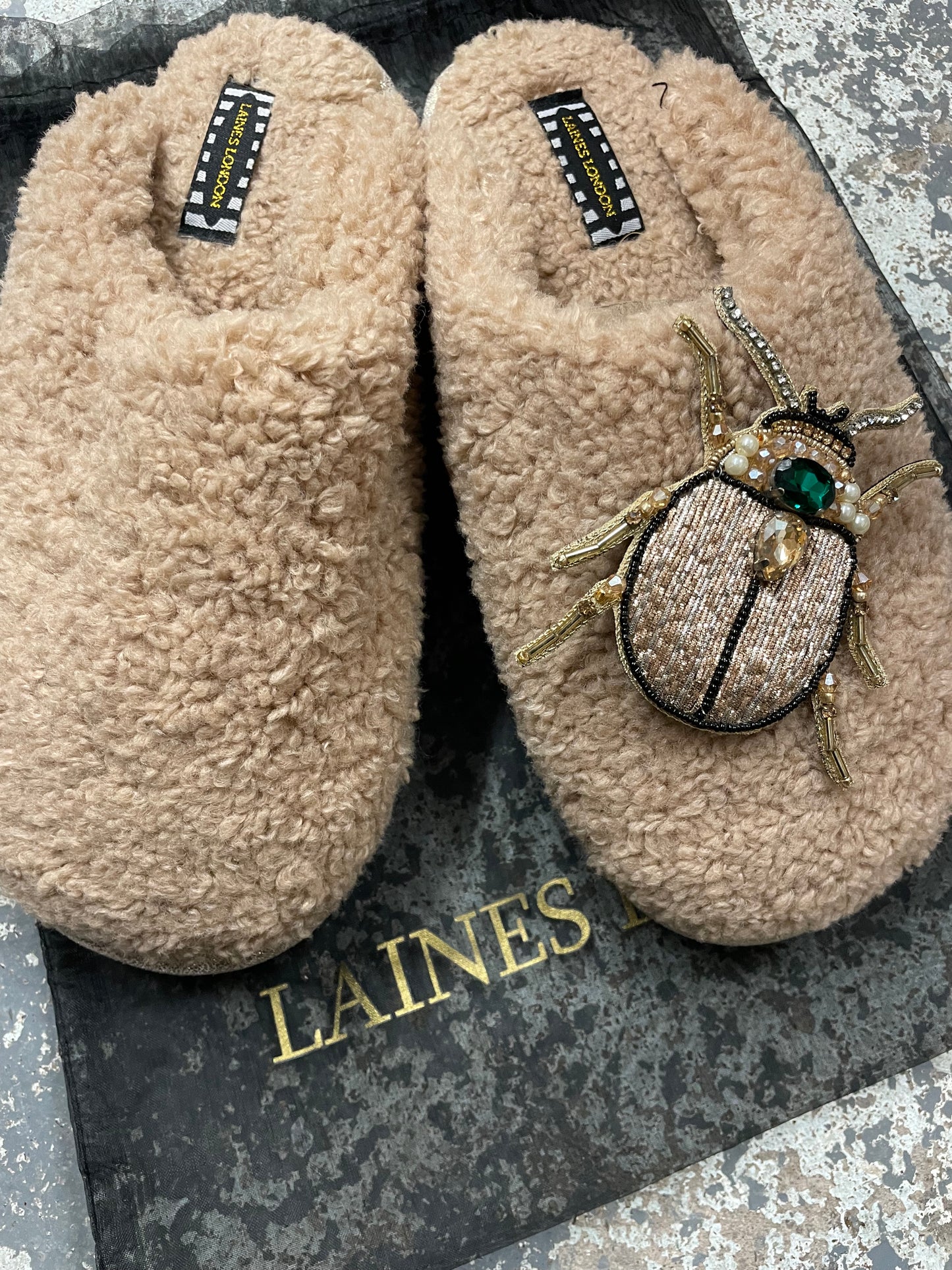 Beige closed toe beetle slippers